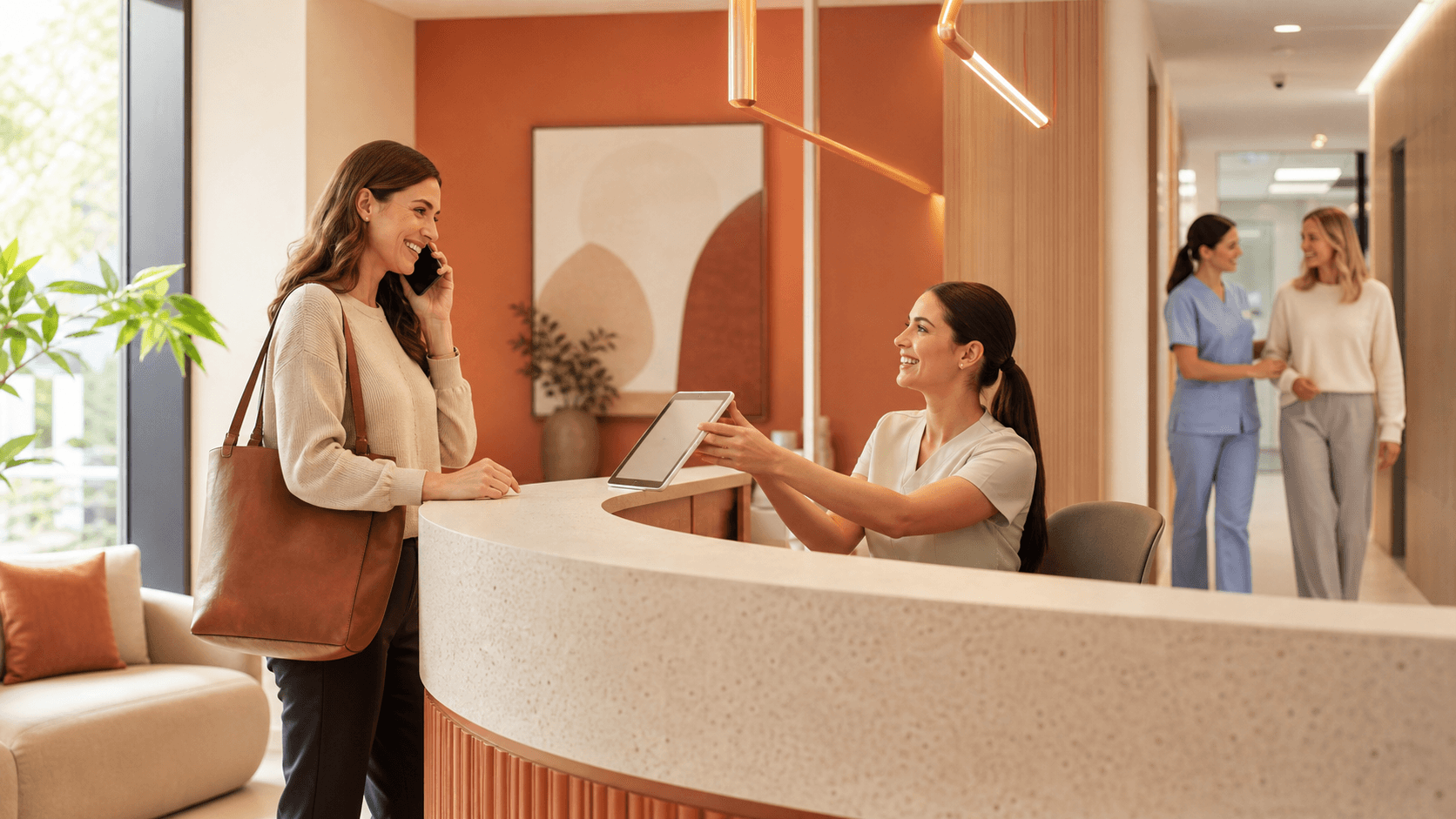 Smiling dentist in blue scrubs greets a patient in a bright, modern dental clinic with soft natural light.
